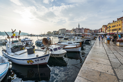 Rovinj, Croatia - October 8, 2023: Small boats in the crowded harbor in Rovinj at sunset