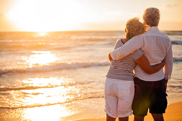 istock Senior couple relaxing by the sea 174979695