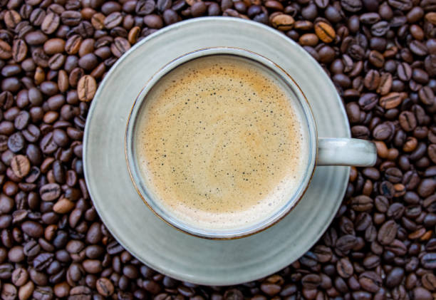 istock Cup with coffe on the roasted coffe beans. 1749799153