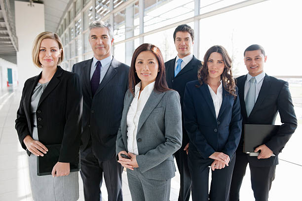 istock Multi-Ethnic Business Team Standing Together 174980358