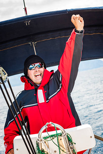 istock Happy skipper driving sailboat 174980620