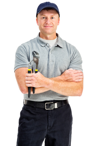 Photo of a handyman holding a pair of channel lock plyers; isolated on white.
