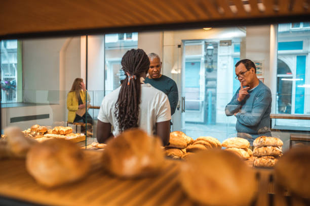 istock Diverse Customers Buying Baked Goods In Small Artisan Bakery 1749808814