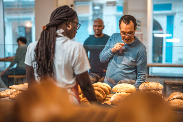 istock Black Female Offering Freshly Baked Bread At An Artisan Bakery 1749809322