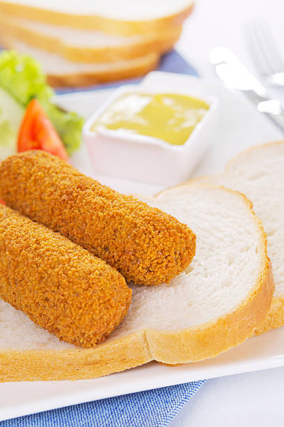 istock Dutch meat croquettes ('kroket') and bread on a plate 174981110