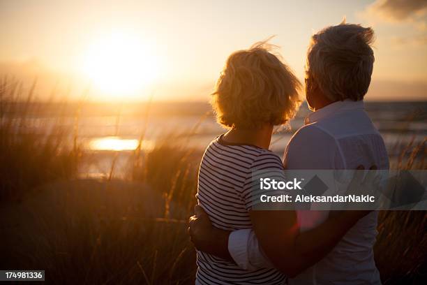 Senior Couple In Love Stock Photo - Download Image Now - Senior Couple, Sunset, Looking At View