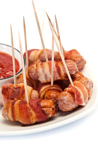 istock Sausages Wrapped In Bacon 174981425