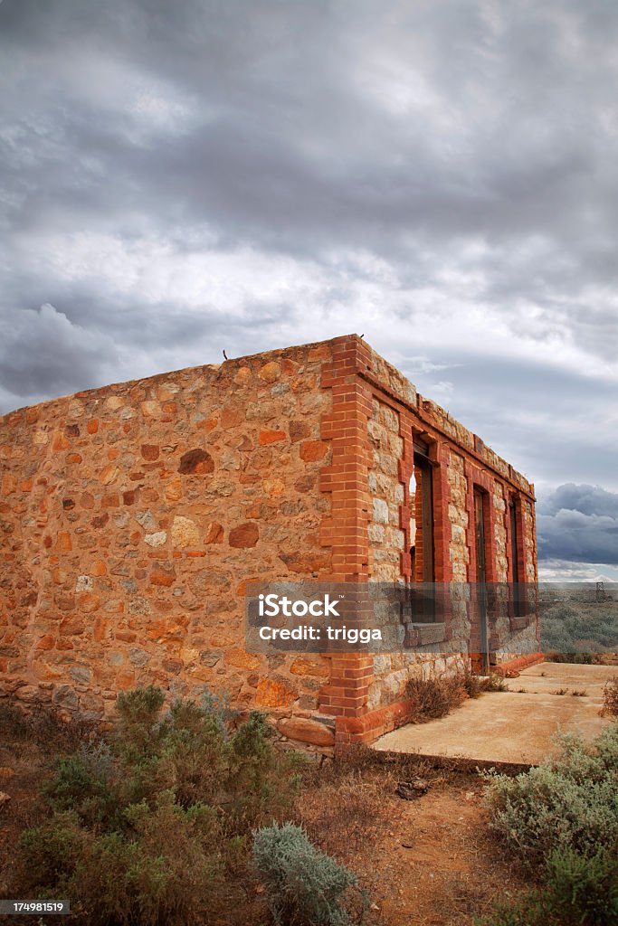 Storm over ruined house at Silverton, Australia A storm gathering at the historic town of Silverton, Australia Abandoned Stock Photo