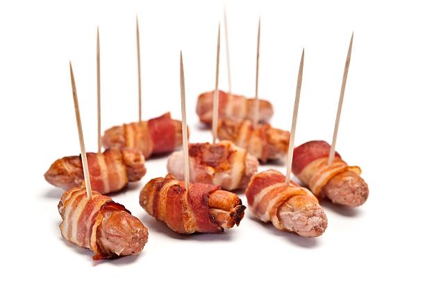 istock Sausages Wrapped In Bacon 174981573