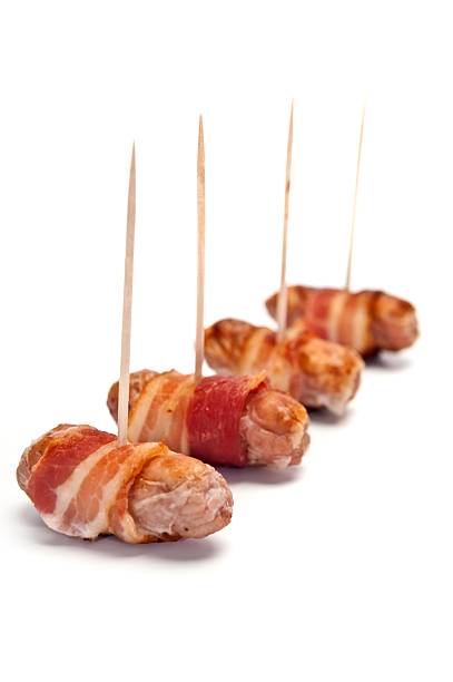istock Sausages Wrapped In Bacon 174981575