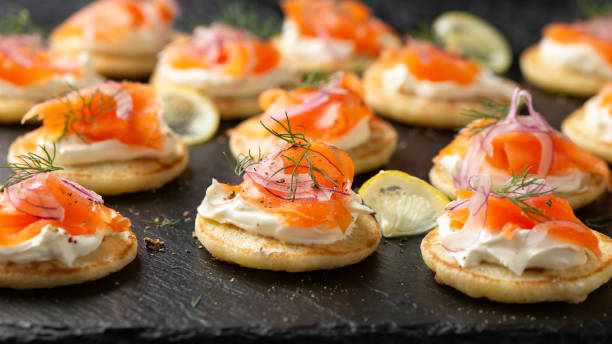 istock Mini blini pancakes with soft cheese, cold smoked salmon and dill 1749818209
