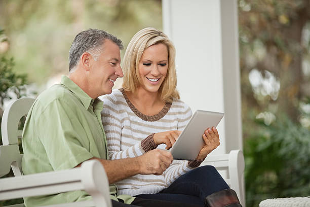 istock Happy couple in casuals using digital tablet 174981863