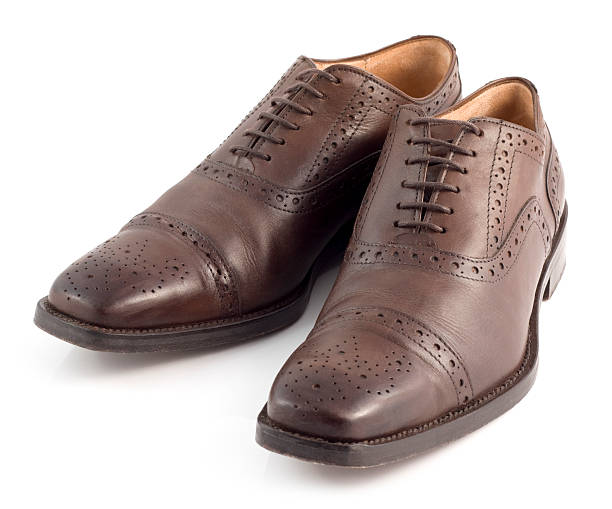 istock Pair of brown leather brogue shoes with decorative patterns 174982026