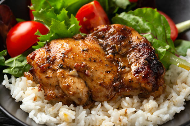 istock Baked balsamic chicken thighs with rice and vegetables 1749820407