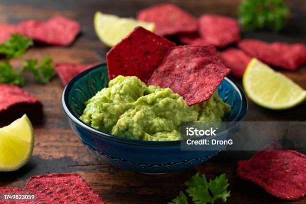 Whole Grain Beetroot Crackers With Avocado Guacamole Dip Stock Photo - Download Image Now