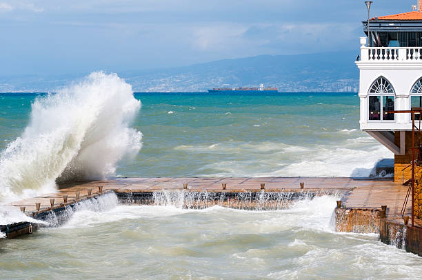 A large swell crashes against a dock on the Corniche in Beirut, Lebanon.