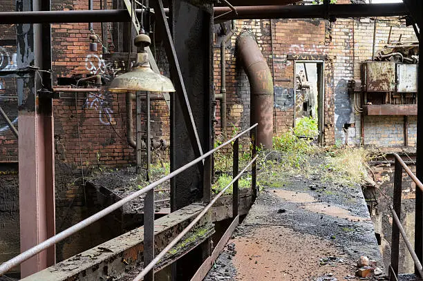 Photo of Abandoned Industrial Walkway, Desolate Factory Scene