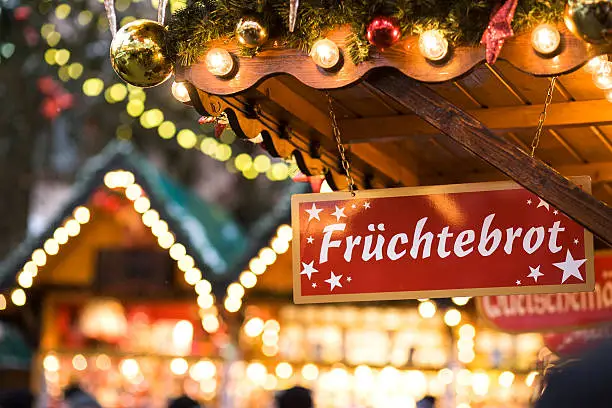 "Sign at christmas market, german word Fruechtebrot which means fruit cake"