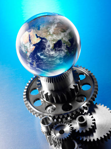 istock World Globe on the Top of Metal Wheels and Cogs 174982761