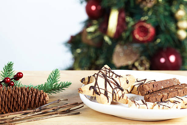 istock Biscotti and star cookies with christmas decorations on table 174983572