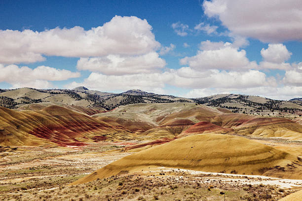 colorful painted hills with spectacular sunset clouds