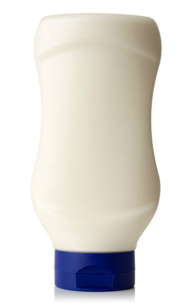 mayonnaise flasche auf weißem hintergrund - mayonnaise stock-fotos und bilder