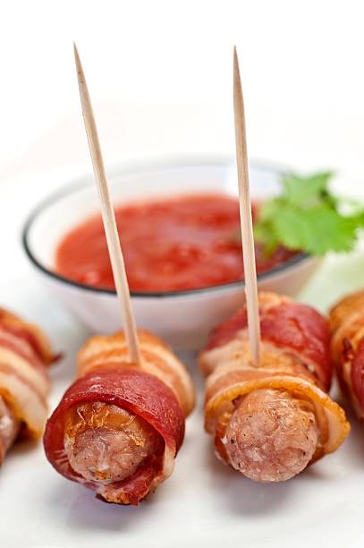 istock Sausages Wrapped In Bacon 174984271