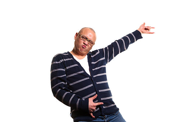 Fun Rock Star Asian Man Playing Air Guitar "A crazy young man rocking out to his air guitar. Shot on a white background, and isolated in post processing. Horizontal composition with copy space and clipping path." air guitar stock pictures, royalty-free photos & images