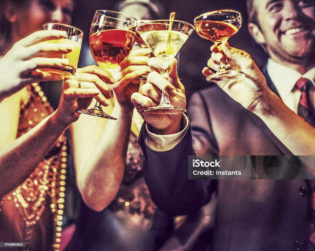 Celebration Five friends cheering in a bar. Achievement Stock Photo