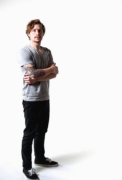 istock Young Attractive Caucasian Tattoo Hipster Man on White Background 174984784