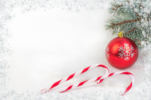 Christmas composition of fir branches and Christmas balls of viburnum on a white background isolated