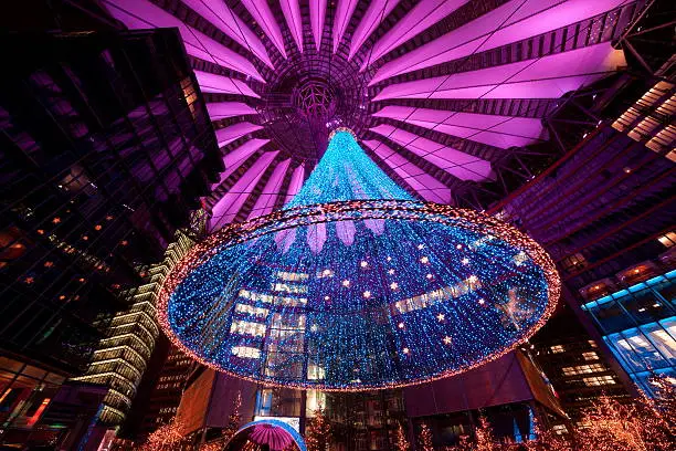 The beautiful night of the christmas market decorated with lights in the Sony Center of Berlin