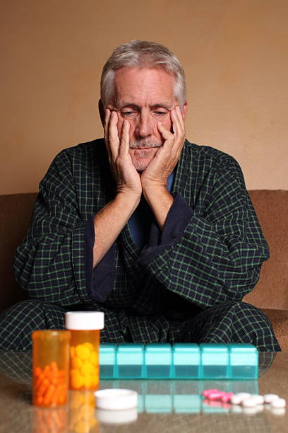 istock Senior Man Depressed at Medication 174985909