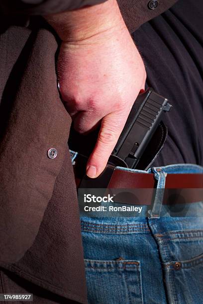 Concealed Carry Firearm Drawn From An Insidethewaistband Holster Stock Photo - Download Image Now