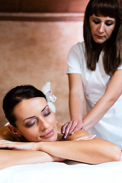 istock Beautiful woman enjoying back massage 174986083