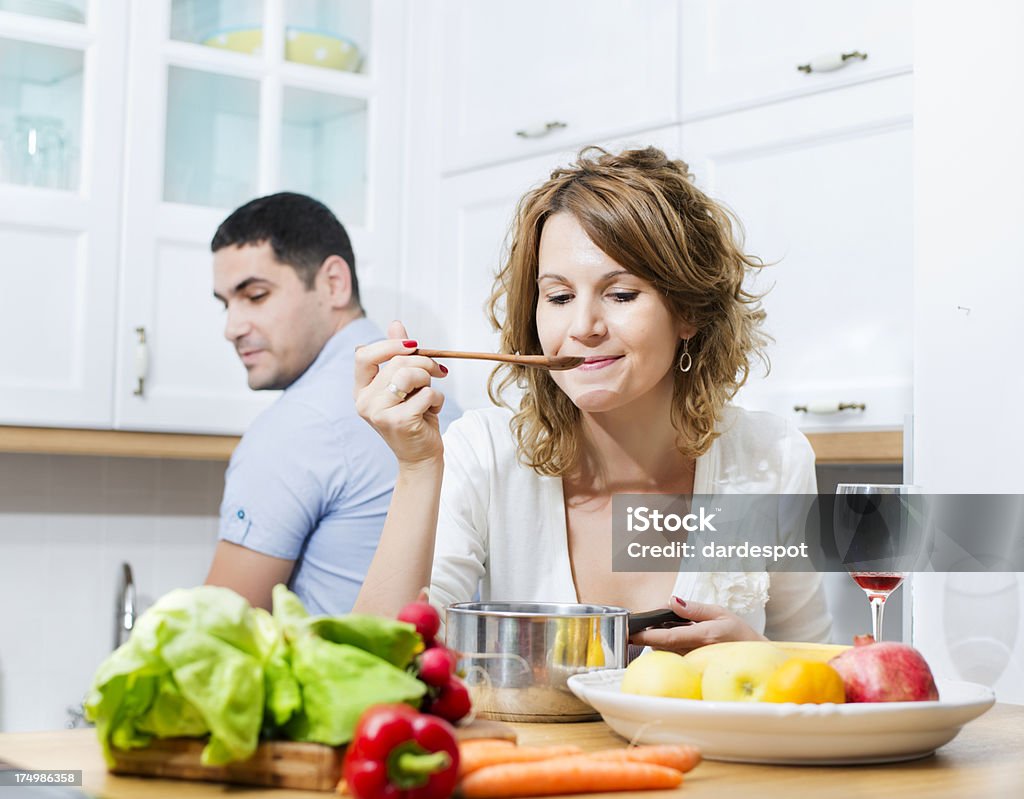 Tasting food Young couple cooking 30-34 Years Stock Photo