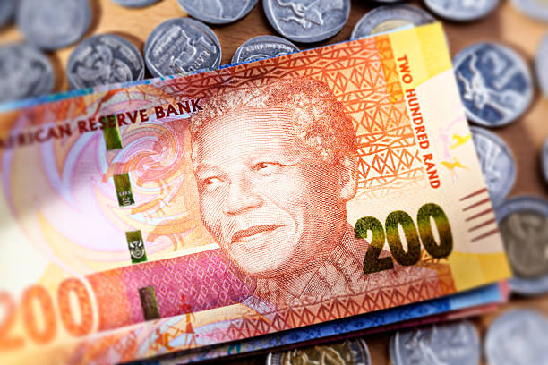 istock New Two Hundred Rand South African banknote resting on coins 174986371