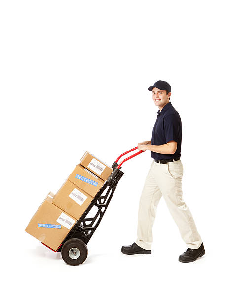 istock Confidence Proud Delivery Man with Package Push Cart on White 174986748
