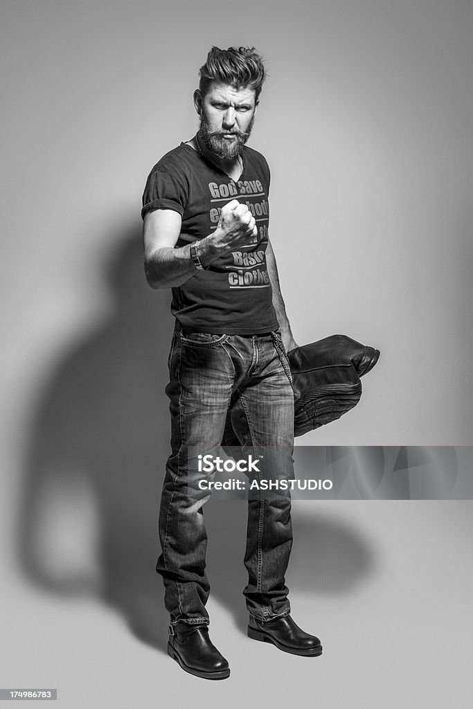 Retrato de un hombre fuerte - Foto de stock de Blanco y negro libre de derechos