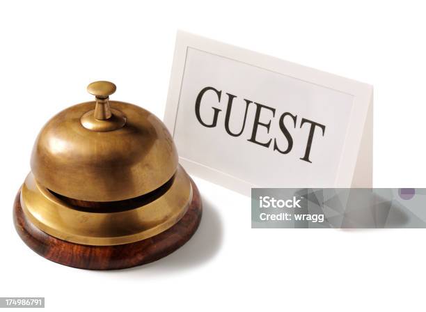 Brass Bell With The Word Guest On A Card Stock Photo - Download Image Now - Assistance, Bell, Brass