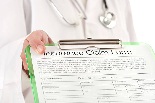 istock Doctor showing an insurance claim form 174987504