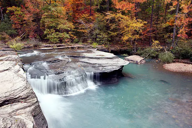 "Haw Creek waterfall during peak autumn/fall colors in Pelsor, Arkansas"