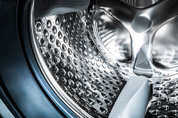Stainless steel drum of a washing machine Inside of stainless steel drum of a washing machine. washing machine drum stock pictures, royalty-free photos & images