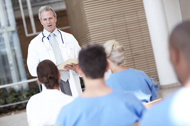 istock Leading his medical team to success 174988934