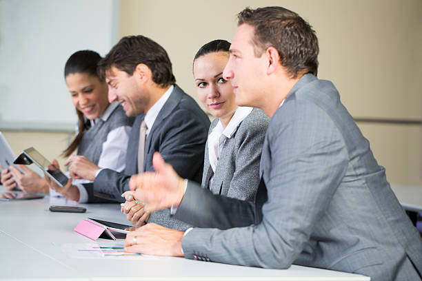istock Business meeting... people checking data on digital tablet and chatting 174989021