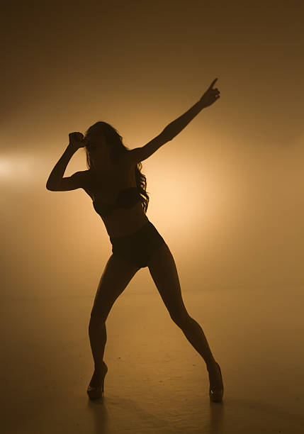 istock Singer with intensity backlit microphone on the big stage 174989259