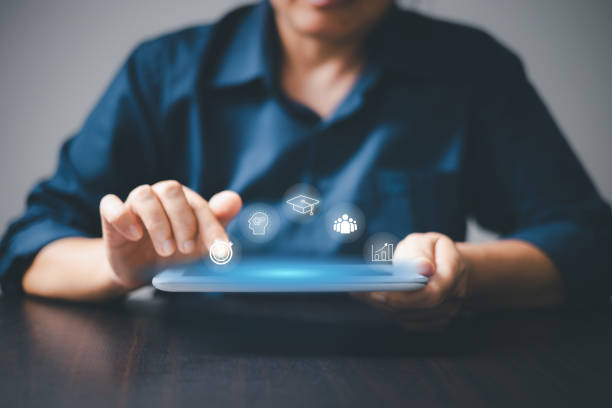istock Education technology, Training online, Education webinar, Person hand working on digital tablet with VR screen training online icon background, education on internet, e-learning concept. 1749907606