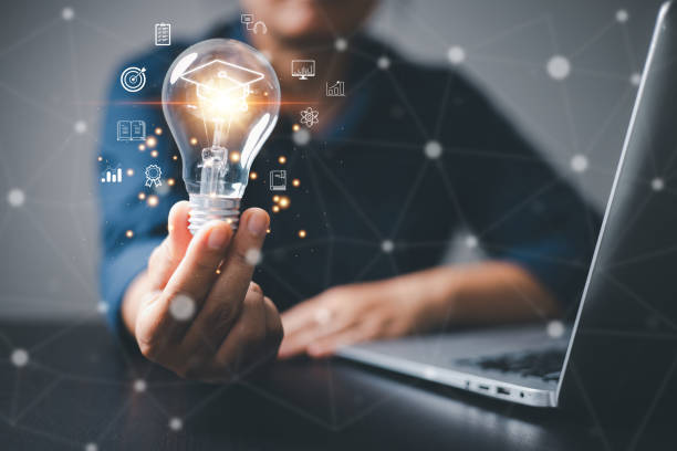 istock Hand holding light bulb showing graduation cap internet education creative with icon and study work knowledge, student school, training learn course. E-Learning postgraduate diploma program concepts. 1749908686