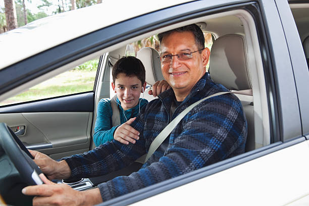 istock Hispanic father and son driving in car 174991047