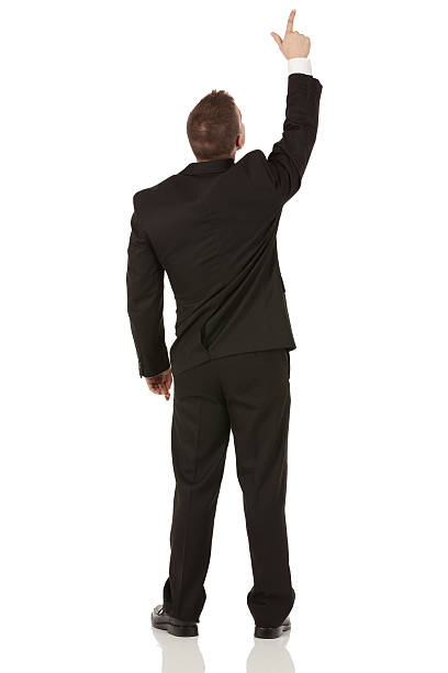 istock Rear view of a businessman pointing upward 174991728